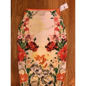 Two piece. Floral/tropical top and hugging skirt.